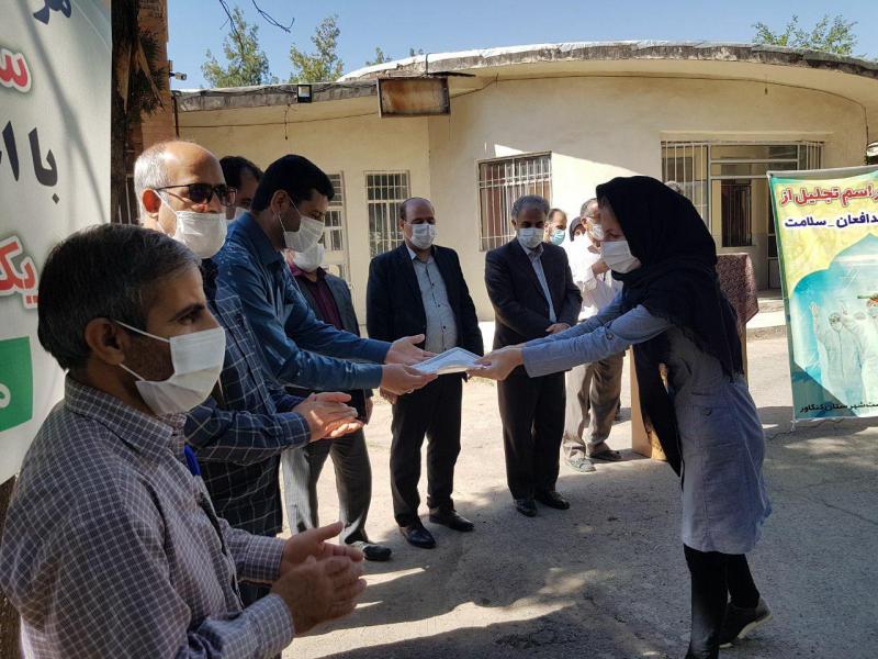 مراسم تجلیل از مدافعان سلامت کنگاور انجام شد + تصویر